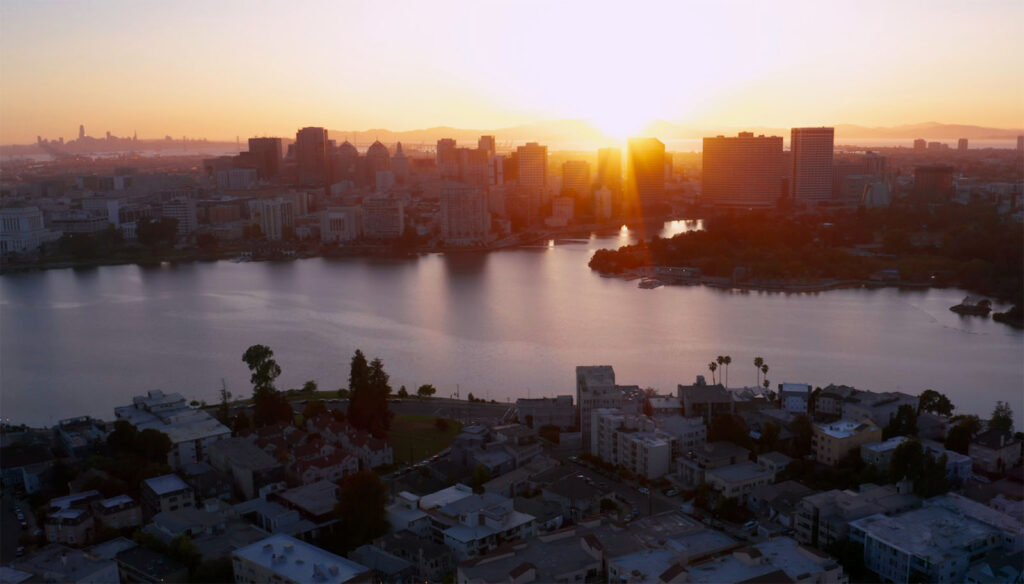 Sunset over Oakland skyline and lake